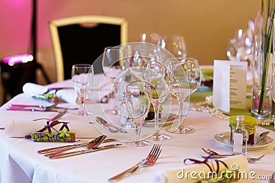 Elegant table set in lilac and green for wedding or event party