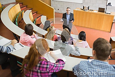 Elegant teacher with students at the lecture hall