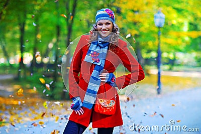 Elegant woman in autumn scenery