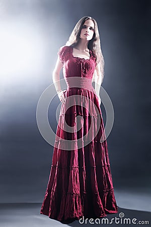 Elegant woman in long dress Fashion model