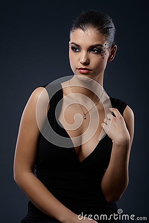 http://thumbs.dreamstime.com/x/elegant-woman-seductive-cocktail-dress-fancy-makeup-black-36843324.jpg