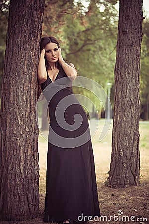 Elegant woman in the wood