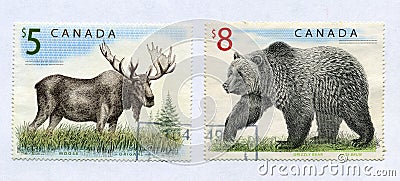 Elk and grizzly on canadian post stamps