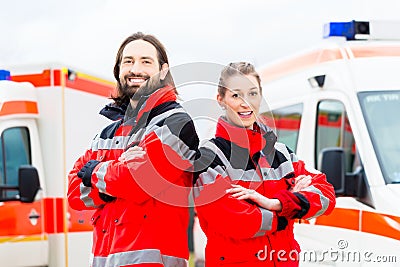 Emergency doctor and paramedic with ambulance