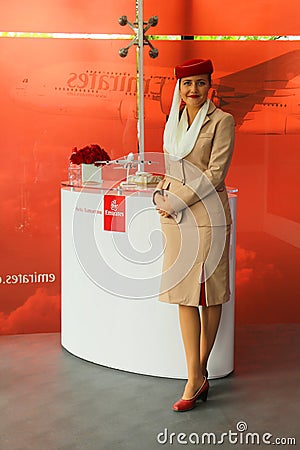 Emirates Airline flight attendant at the Emirates Airline booth at the Billie Jean King National Tennis Center during US Open 2013