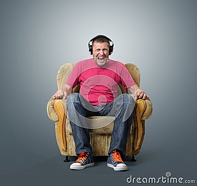Emotional man listens to music on headphones