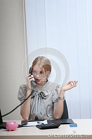 Emotionally business woman on landline phone call, listening to
