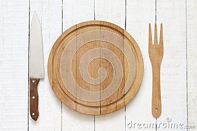 Empty cutting board on white planks food background