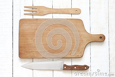 Empty cutting board on white planks food background