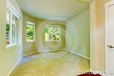 Empty house interior. Simple bedroom with three windows