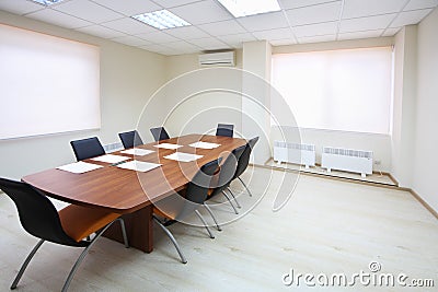 Empty lighting meeting room with long table