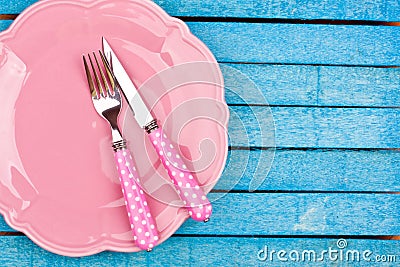 Empty plate and fork, knife