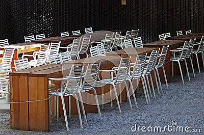 Empty restaurant tables and chairs