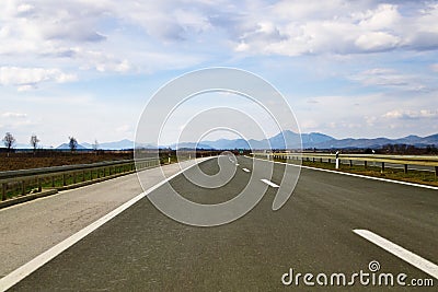 Empty road with distant mountains