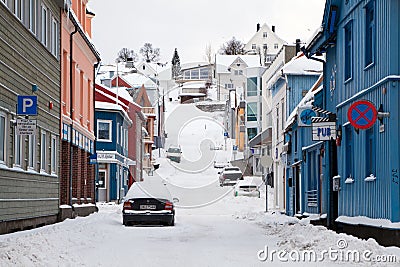Empty street of Tromso covered by snow