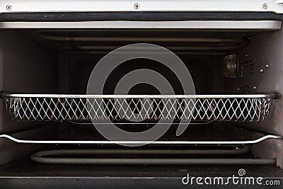 Empty tray inside oven front view