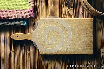 Empty vintage cutting board on planks food background concept