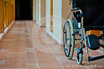 Empty wheelchair in hospital corridor