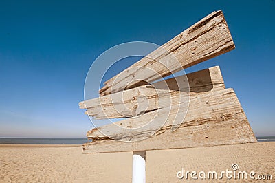 Empty wooden direction sign