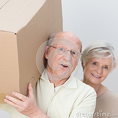 Energetic senior couple moving home