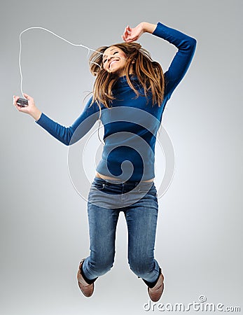 Energetic woman with music player