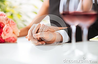 Engaged couple with wine glasses