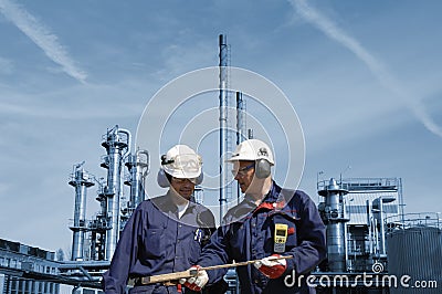 Engineers with oil and gas refinery