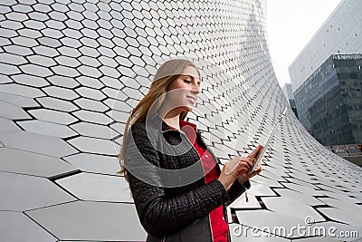 Enjoying her technology in a futuristic environmen