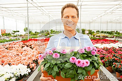 Enjoying his work with plants.