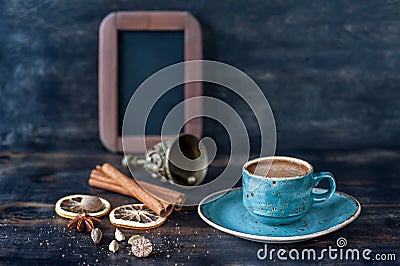 Espresso coffee and spices on a vintage wooden background