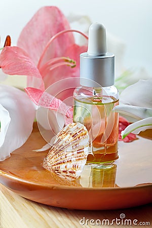 Essential oil for spa treatment in bottle with dropper