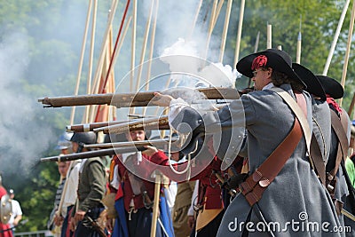 European medieval soldiers shooting rifles