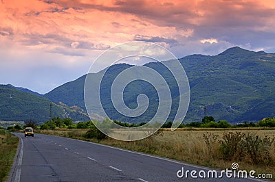 Evening road to mountains