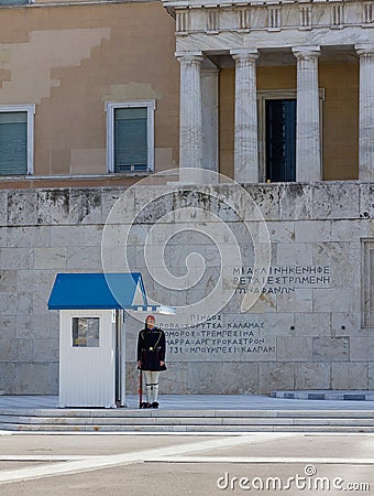 Evzone guard in front of the Greek Parliament and tomb of the Unknown soldier