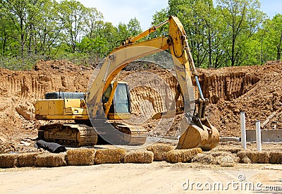 An Excavator Digs A Fresh Hole in the Earth