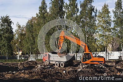 Excavator loading the dump truck