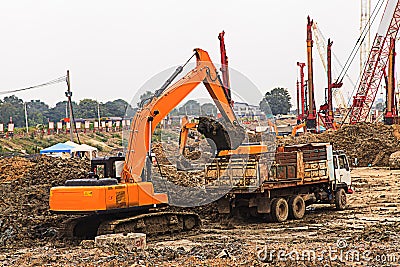 Excavator and truck