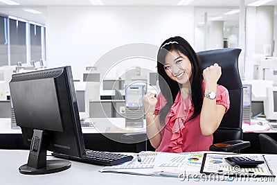 Excited businesswoman celebrating her success