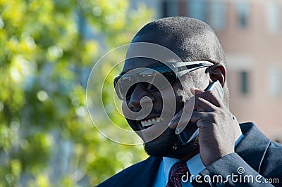Executive on Cell Phone Wearing Sunglasses