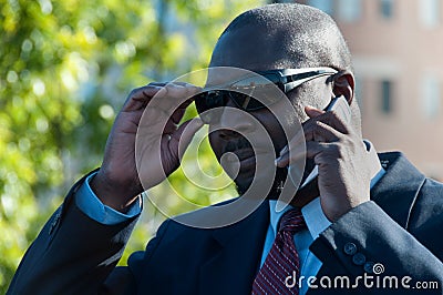 Executive on Cell Phone Wearing Sunglasses