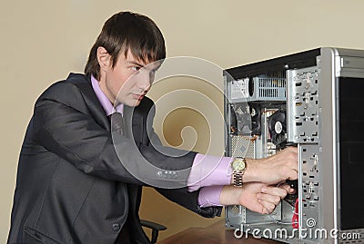 Expert repairing the computer