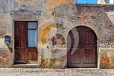 Facade of old abandoned house in Italy.