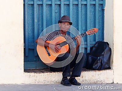 Faces Of Cuba Man Playing In Trinidad