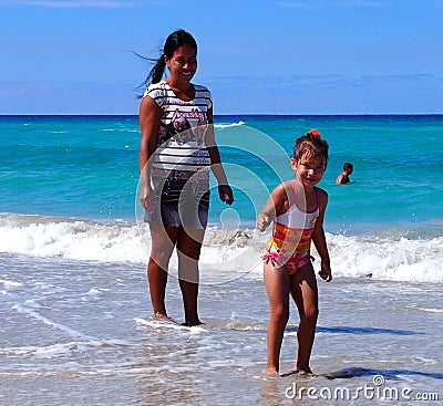 Faces Of Cuba- Woman With Child At Playa Del Este