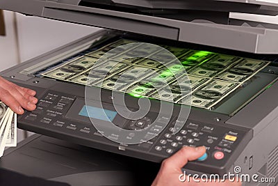Fake money on copy machine in office