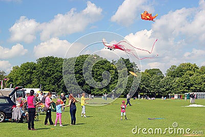 Families flying kites.
