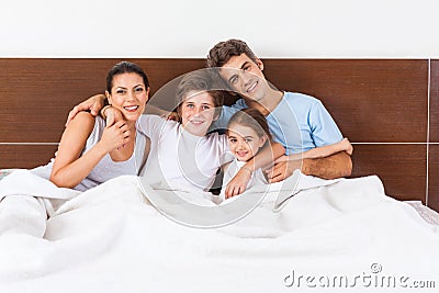 Family on bed bedroom, couple parents children