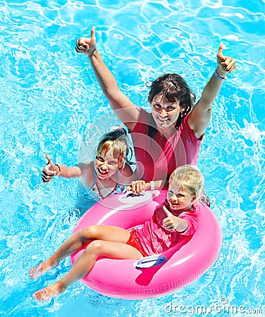 Family in swimming pool.