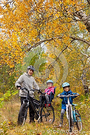 Family cycling outdoors