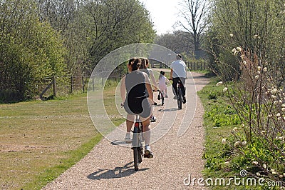 Family cycling on summers day